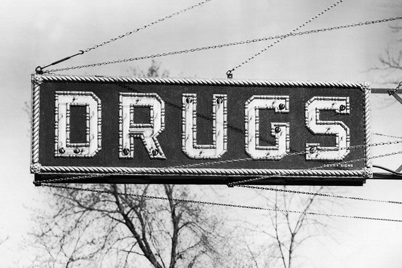 Black and white vintage photo of a drug store sign