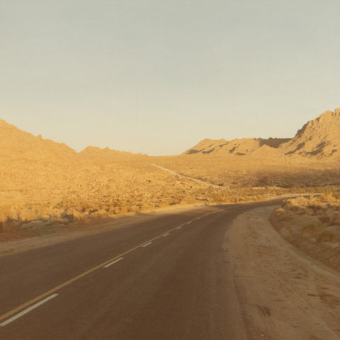 Vintage photograph of a gold toned Route 66 empty highway