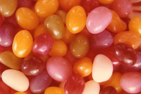 Colorful vintage photograph of yellow, lavender, white and green jelly beans 