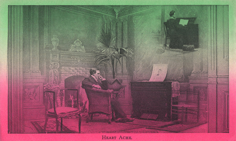 Pink and green tinted vintage postcard image of a man staring at a portrait of a woman, with the word "heart ache" at the bottom.
