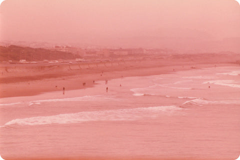 Vintage photograph of a pink-hued Orange County beach